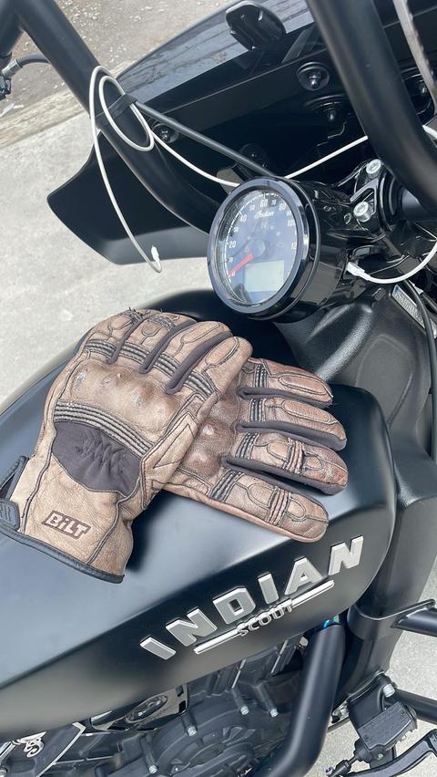 A close view of a black motorcycle and its fuel tank.
